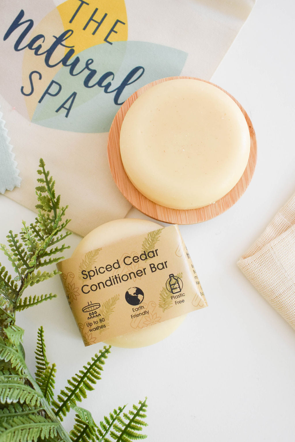 Spiced Cedar Solid Conditioner bar with natural ingredients, showcasing its unique design and eco-friendly packaging.