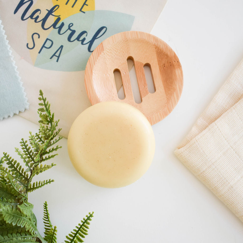 Spiced Cedar Solid Conditioner bar with natural ingredients, showcasing its unique design and eco-friendly packaging.