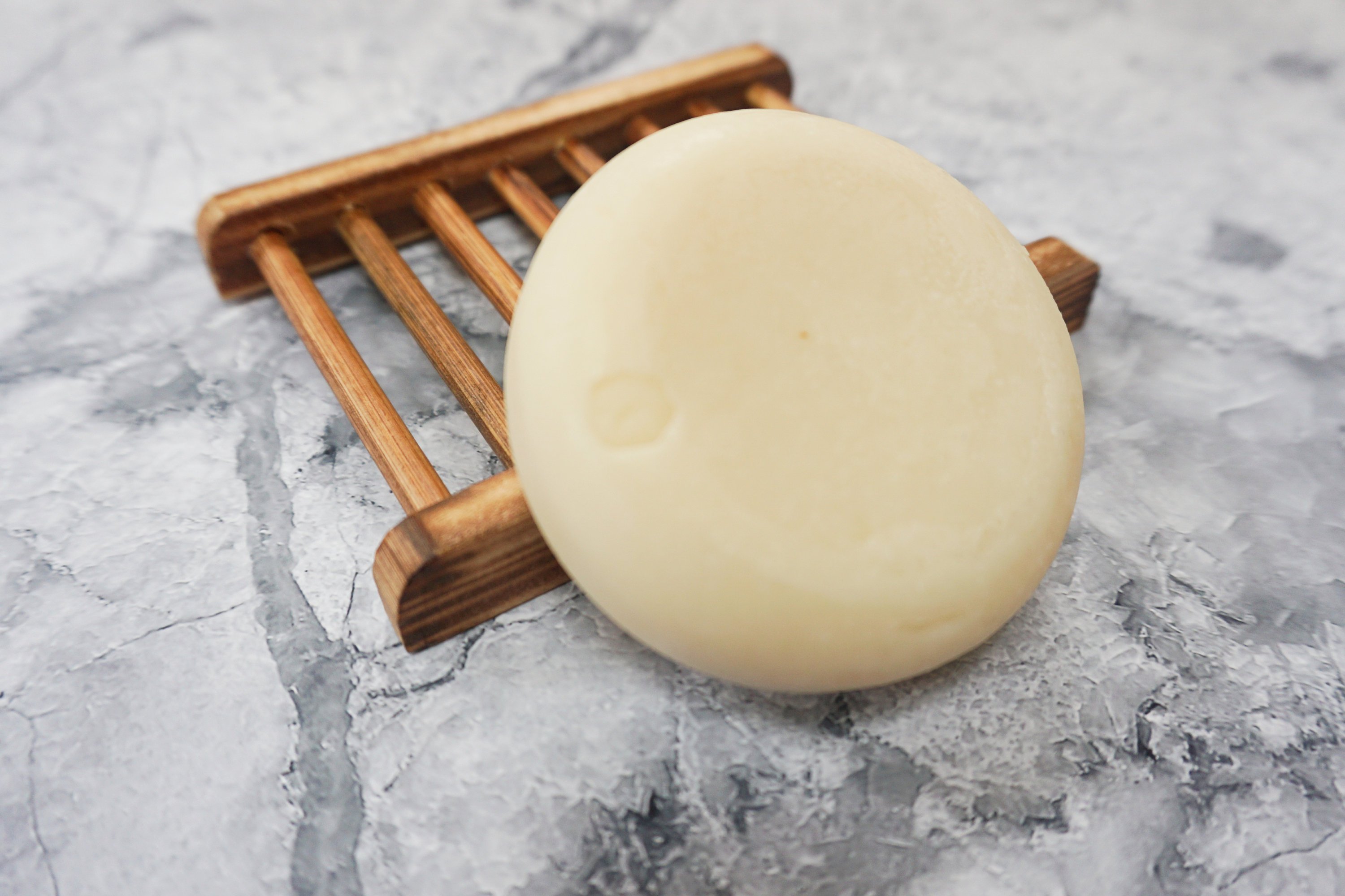 Spiced Cedar Solid Conditioner bar with natural ingredients, showcasing its unique design and eco-friendly packaging.