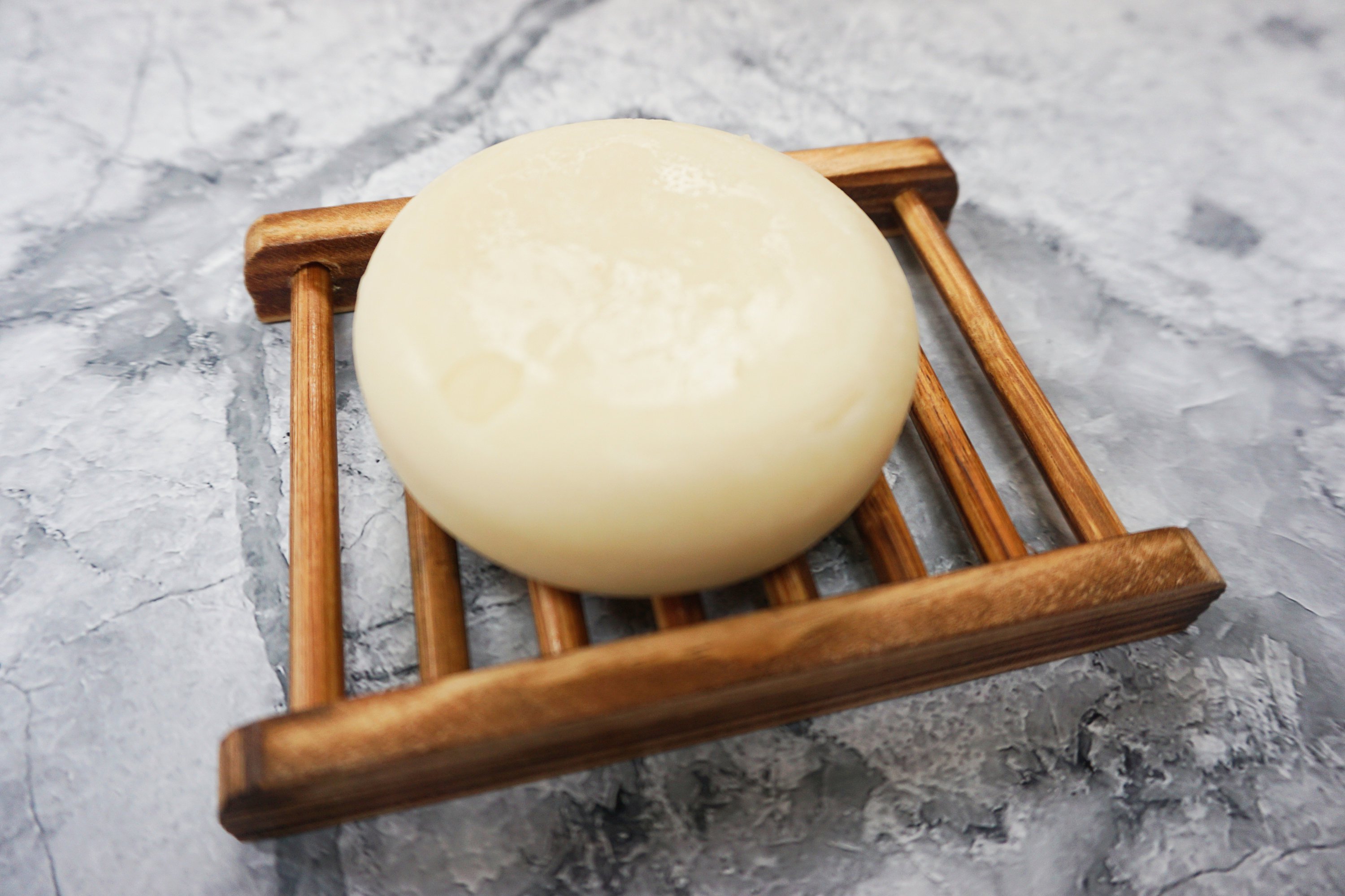 Spiced Cedar Solid Conditioner bar with natural ingredients, showcasing its unique design and eco-friendly packaging.