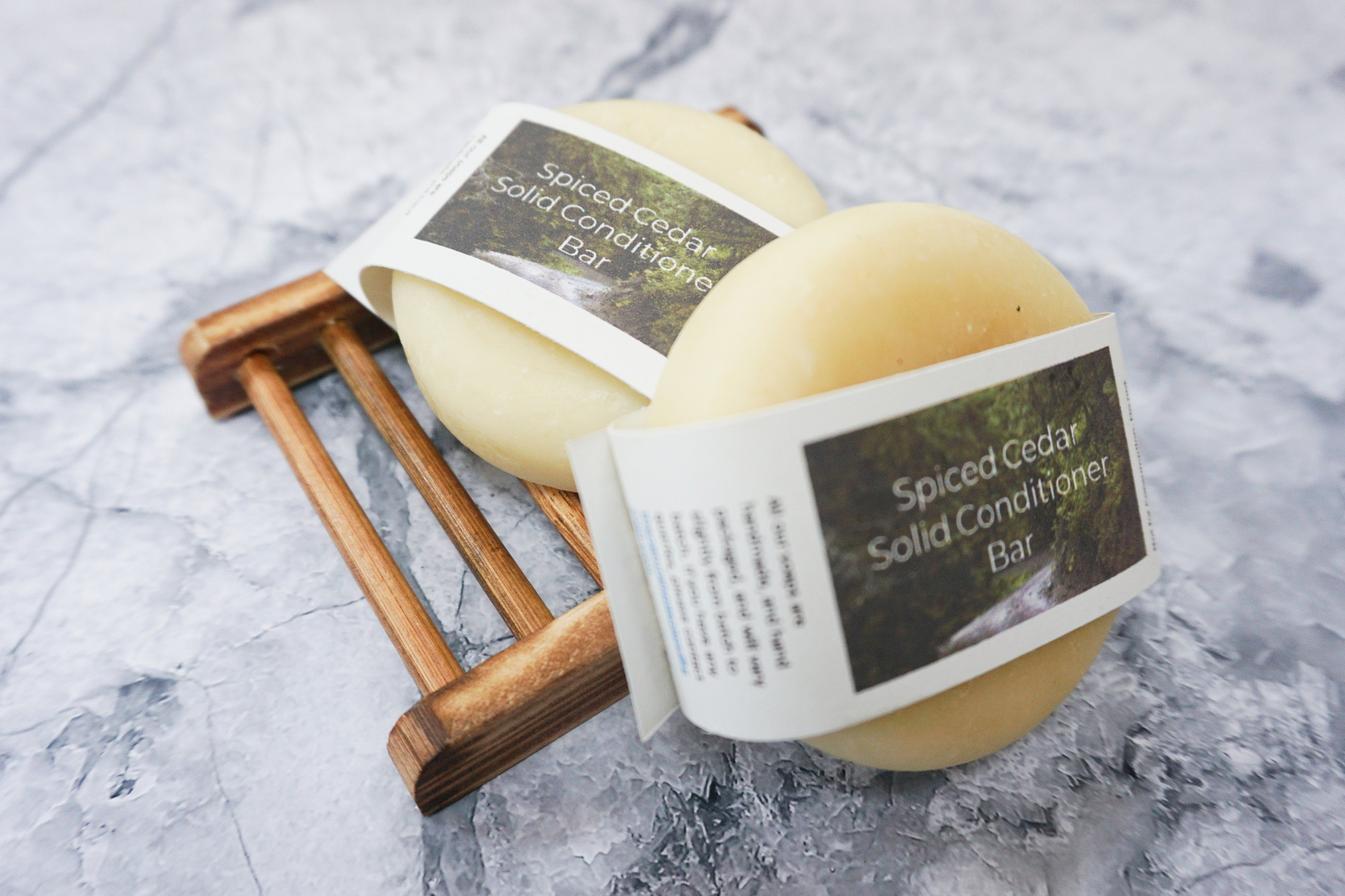 Spiced Cedar Solid Conditioner bar with natural ingredients, showcasing its unique design and eco-friendly packaging.