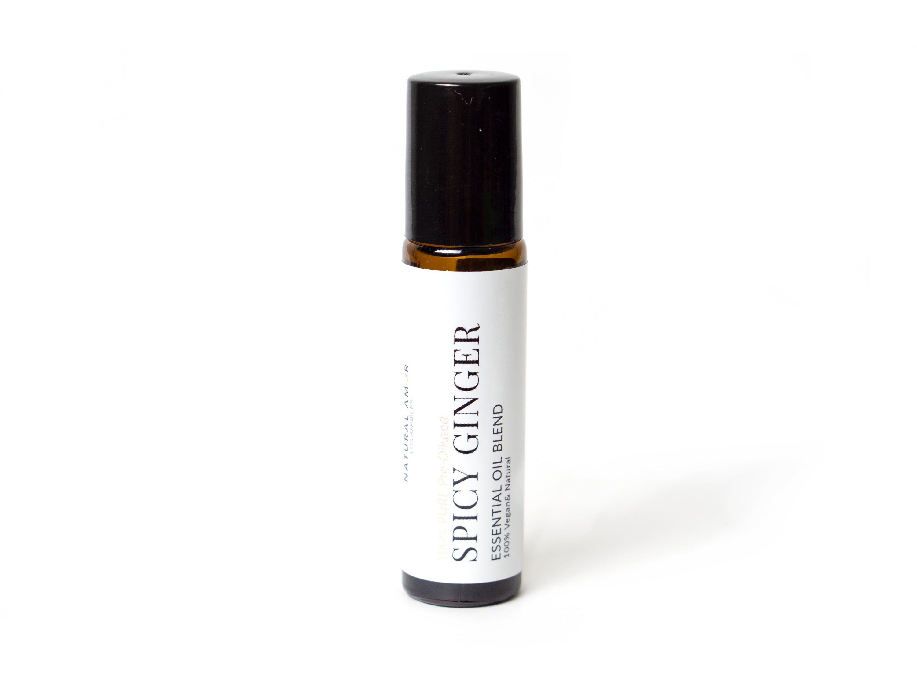 Spicy Ginger Roll On Essential Oil Blend in a 10 mL bottle with a stainless steel rollerball, showcasing its warm and inviting aroma.