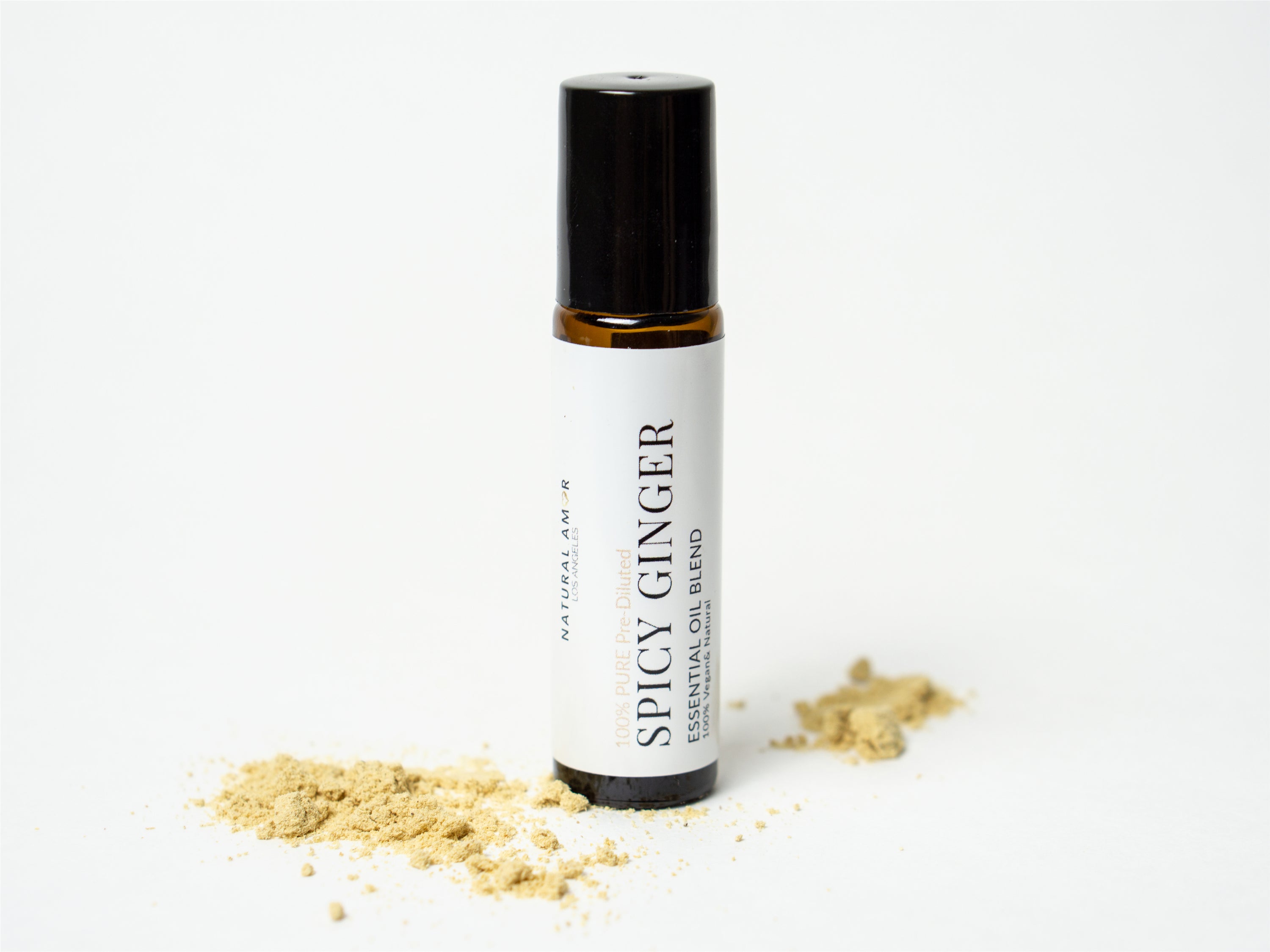 Spicy Ginger Roll On Essential Oil Blend in a 10 mL bottle with a stainless steel rollerball, showcasing its warm and inviting aroma.