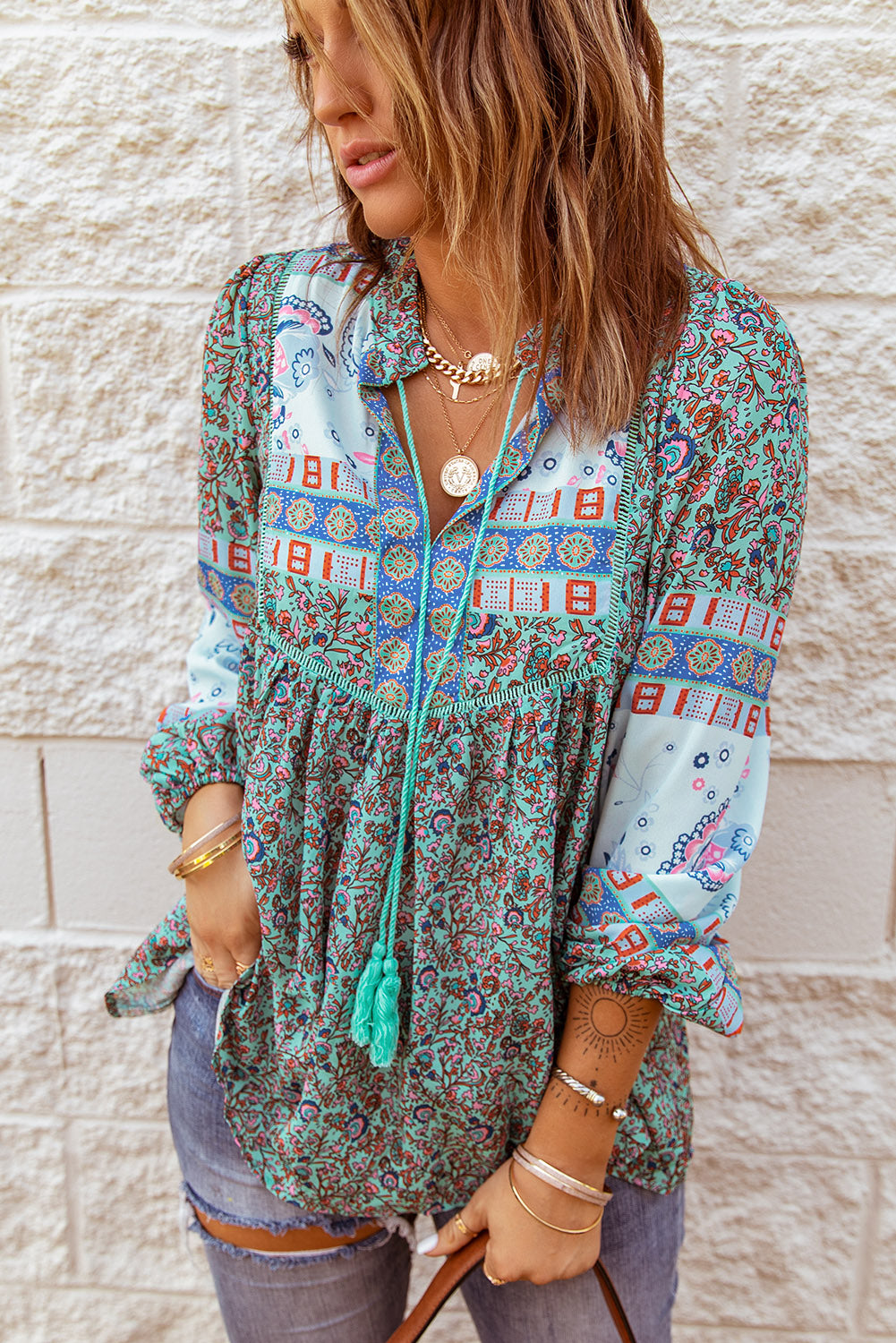 A stylish Split Neck Bubble Sleeve Floral Patchwork Blouse featuring a unique floral design, split v-neck, and bubble sleeves, perfect for casual wear.