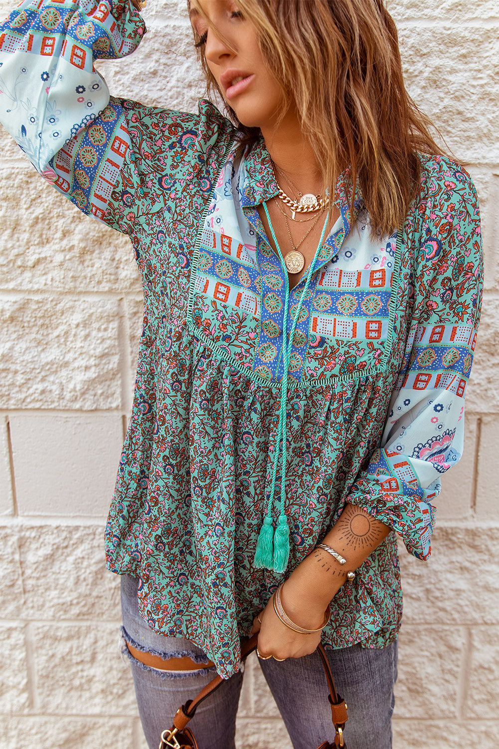 A stylish Split Neck Bubble Sleeve Floral Patchwork Blouse featuring a unique floral design, split v-neck, and bubble sleeves, perfect for casual wear.