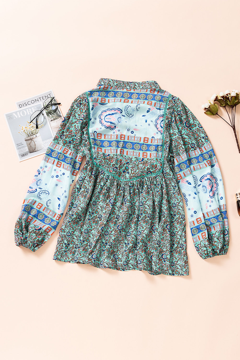 A stylish Split Neck Bubble Sleeve Floral Patchwork Blouse featuring a unique floral design, split v-neck, and bubble sleeves, perfect for casual wear.