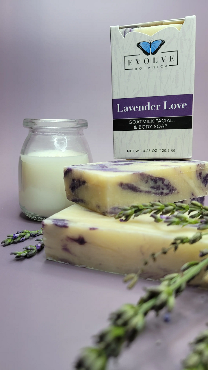 Lavender Love Goatmilk Soap bar with lavender flowers and natural ingredients, showcasing its creamy texture and soothing color.