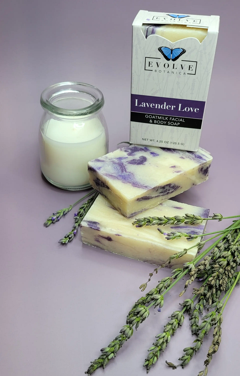 Lavender Love Goatmilk Soap bar with lavender flowers and natural ingredients, showcasing its creamy texture and soothing color.