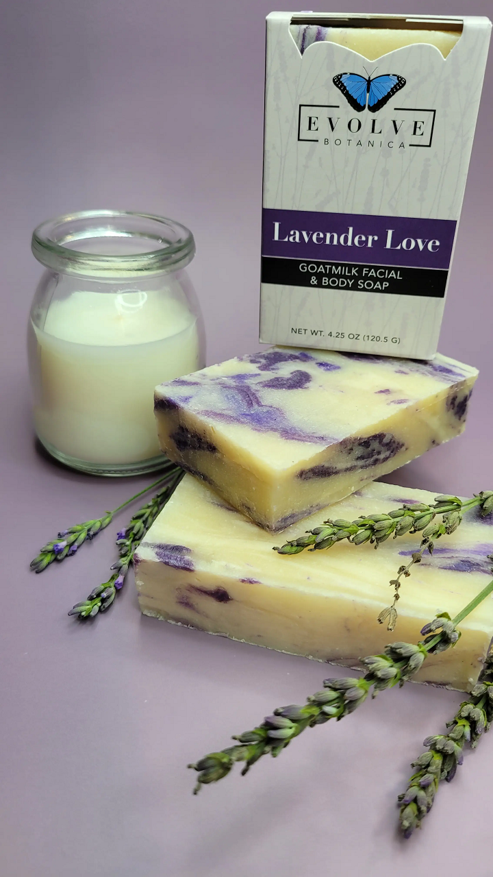 Lavender Love Goatmilk Soap bar with lavender flowers and natural ingredients, showcasing its creamy texture and soothing color.