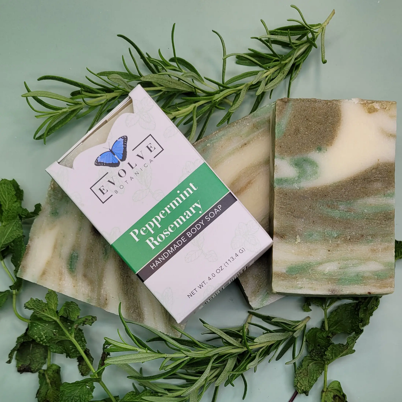 Standard Soap - Peppermint Rosemary with fresh peppermint leaves and rosemary sprigs, showcasing its natural ingredients.