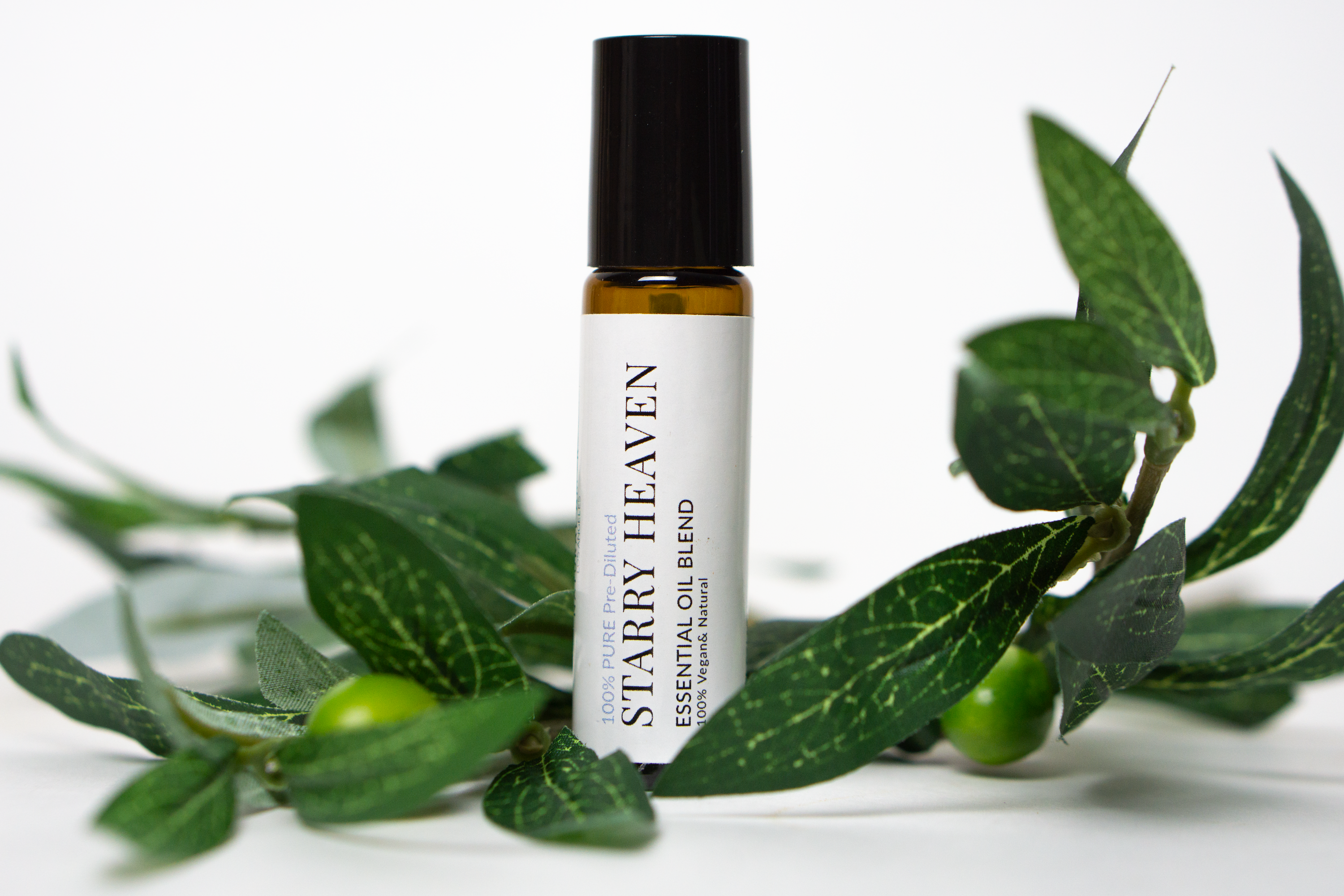 Starry Heaven Roll On Essential Oil Blend in a 10 mL bottle with a stainless steel rollerball, featuring a floral and herbaceous aroma.