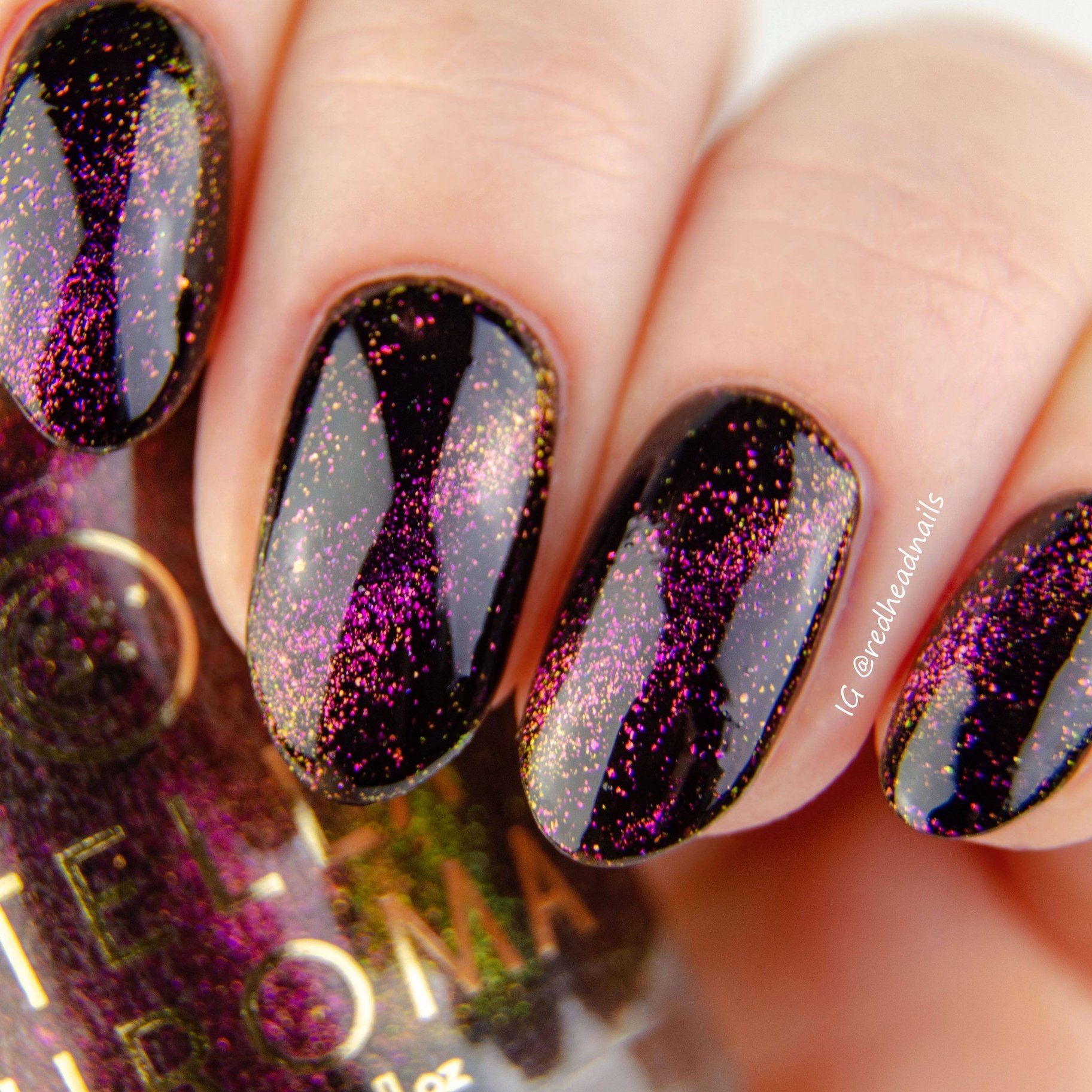 Stella Chroma Nail Polish in Perseus, a black jelly polish with gold-red-violet shifting magnetic flakes in a sleek bottle.