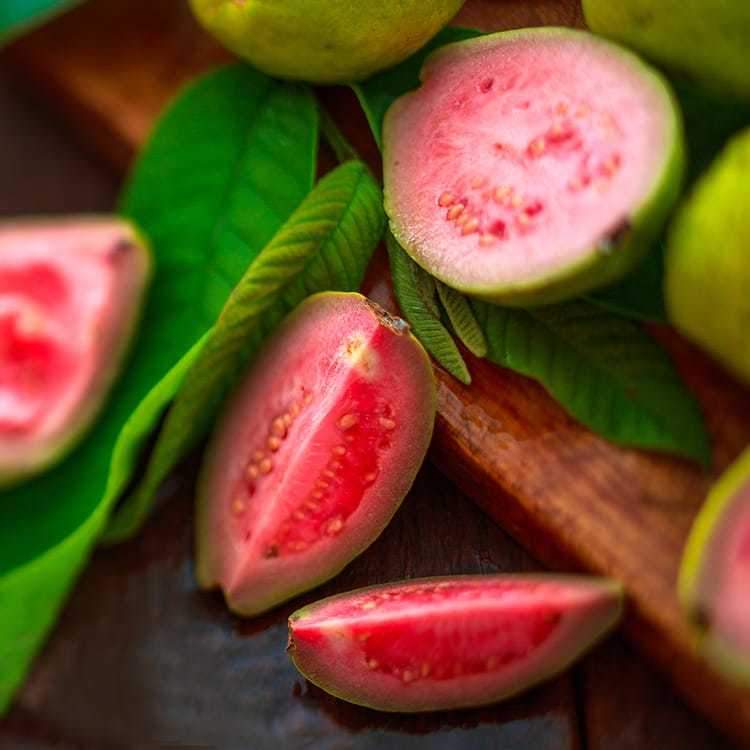 A bottle of Strawberry Guava Lotion featuring a fruity blend of strawberry, guava, and tropical scents, with a smooth texture.