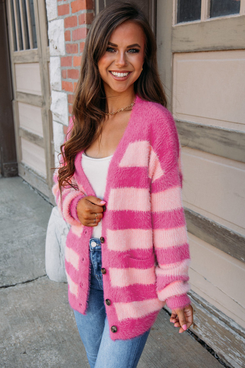 Strawberry Pink Colorblock Striped Buttoned Fuzzy Cardigan with pockets and buttons, showcasing a trendy design.