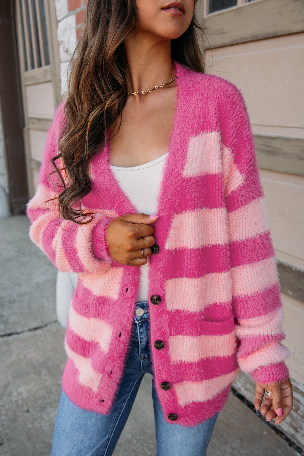 Strawberry Pink Colorblock Striped Buttoned Fuzzy Cardigan with pockets and buttons, showcasing a trendy design.