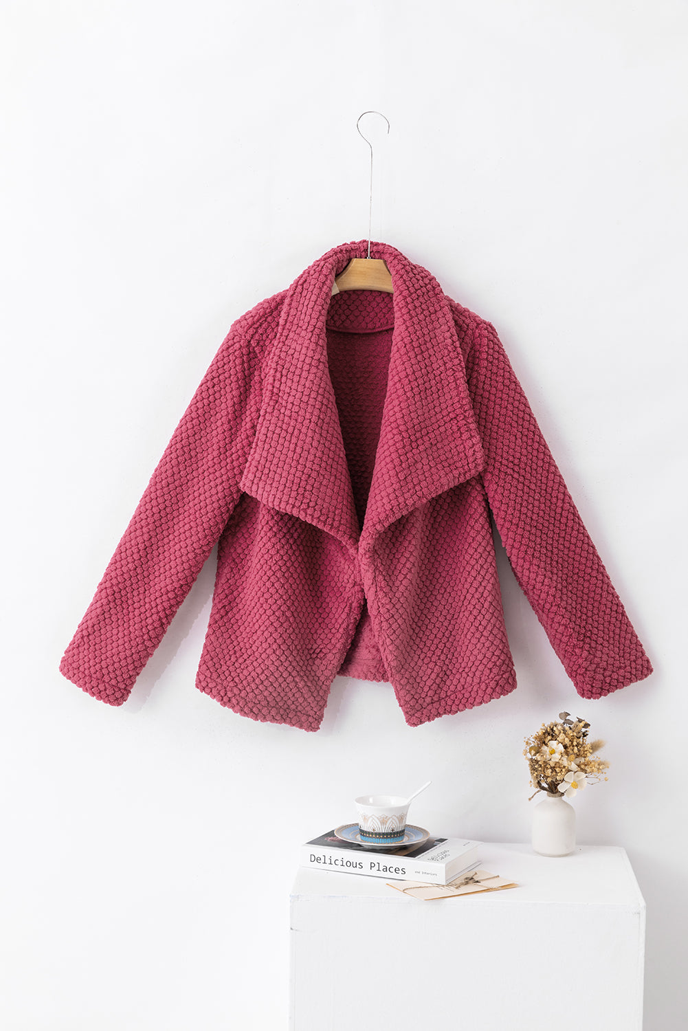 Strawberry pink fleece textured jacket with lapel collar and open front design, perfect for layering in casual outfits.