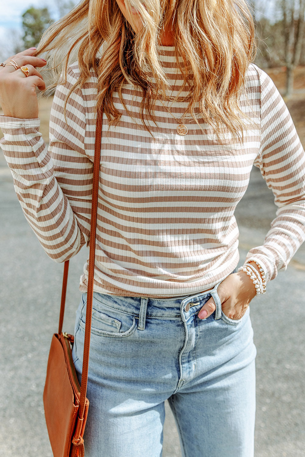 Strawberry pink striped long sleeve tee with textured knit fabric and high neck design, perfect for stylish layering.