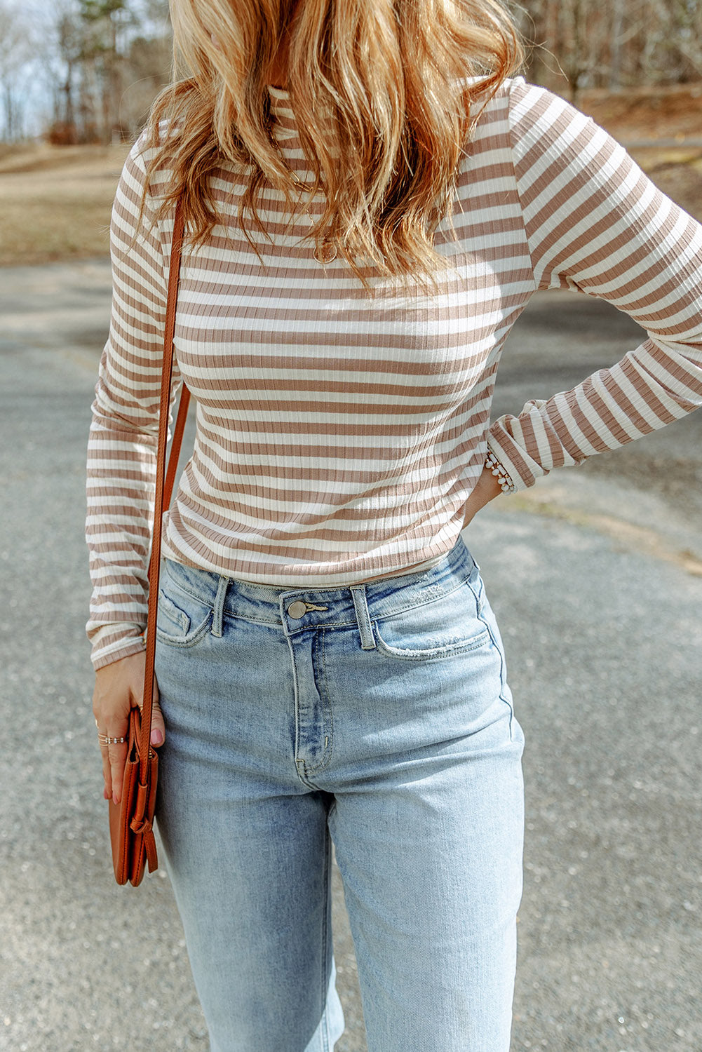 Strawberry pink striped long sleeve tee with textured knit fabric and high neck design, perfect for stylish layering.