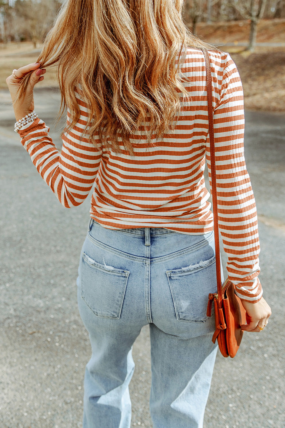 Strawberry pink striped long sleeve tee with textured knit fabric and high neck design, perfect for stylish layering.