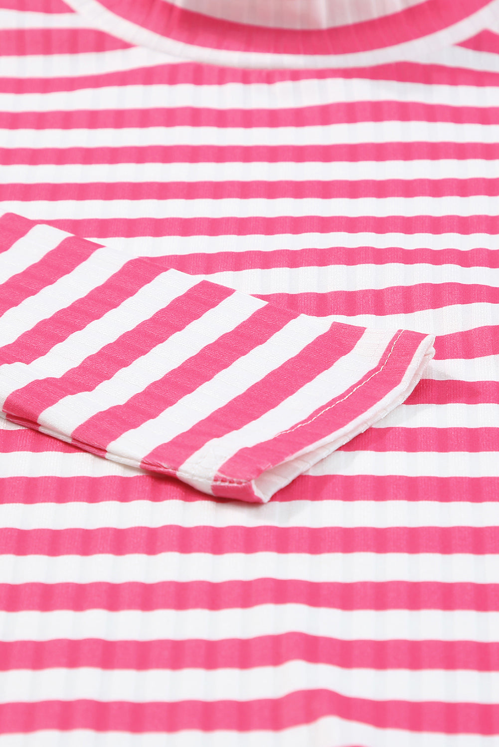 Strawberry pink striped long sleeve tee with textured knit fabric and high neck design, perfect for stylish layering.