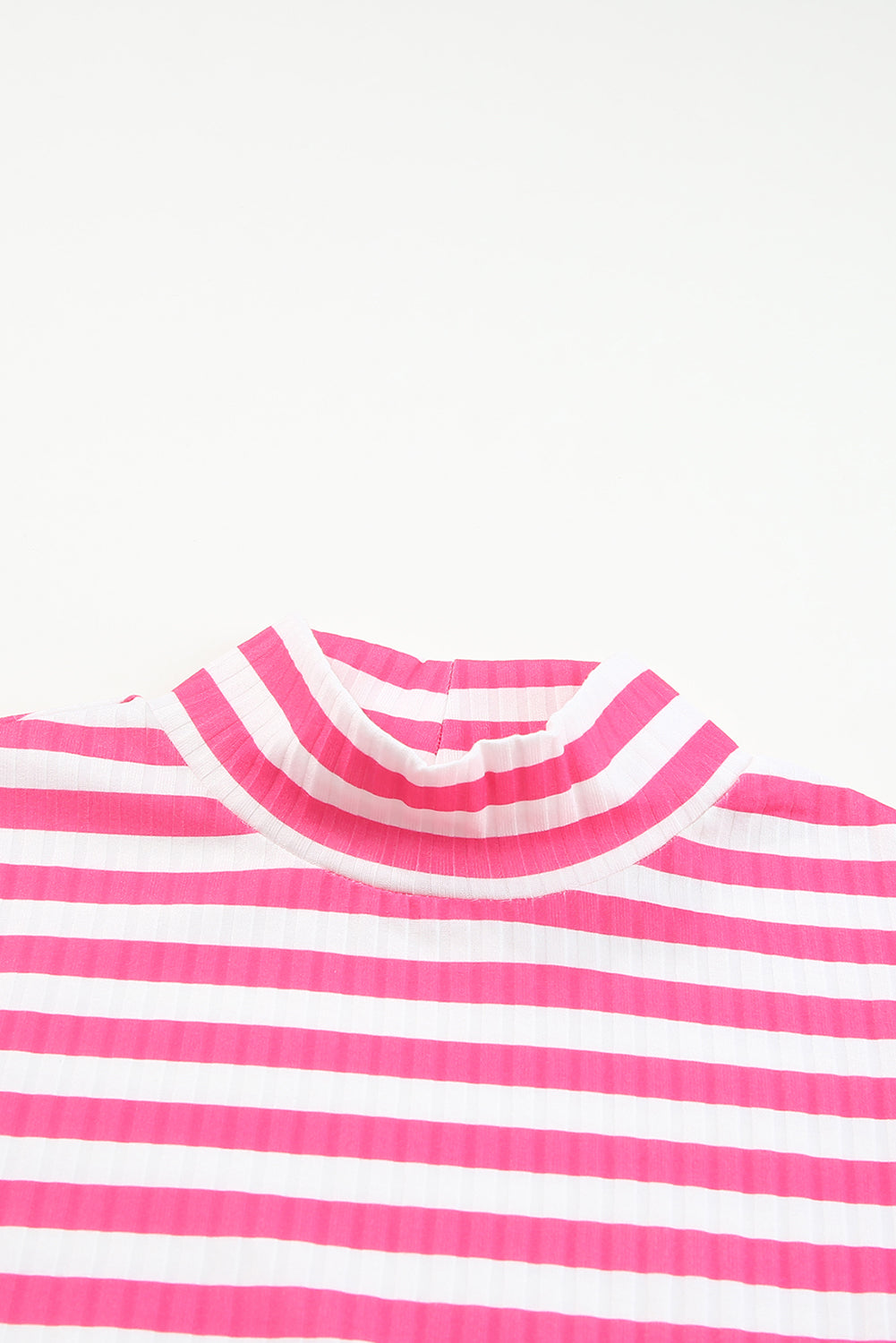 Strawberry pink striped long sleeve tee with textured knit fabric and high neck design, perfect for stylish layering.