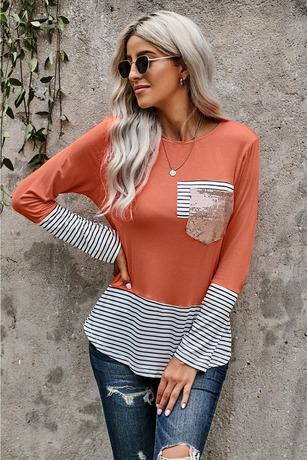 A stylish long sleeve O-neck top featuring a striped sequined patch pocket, colorblock and camo print design, perfect for casual wear.