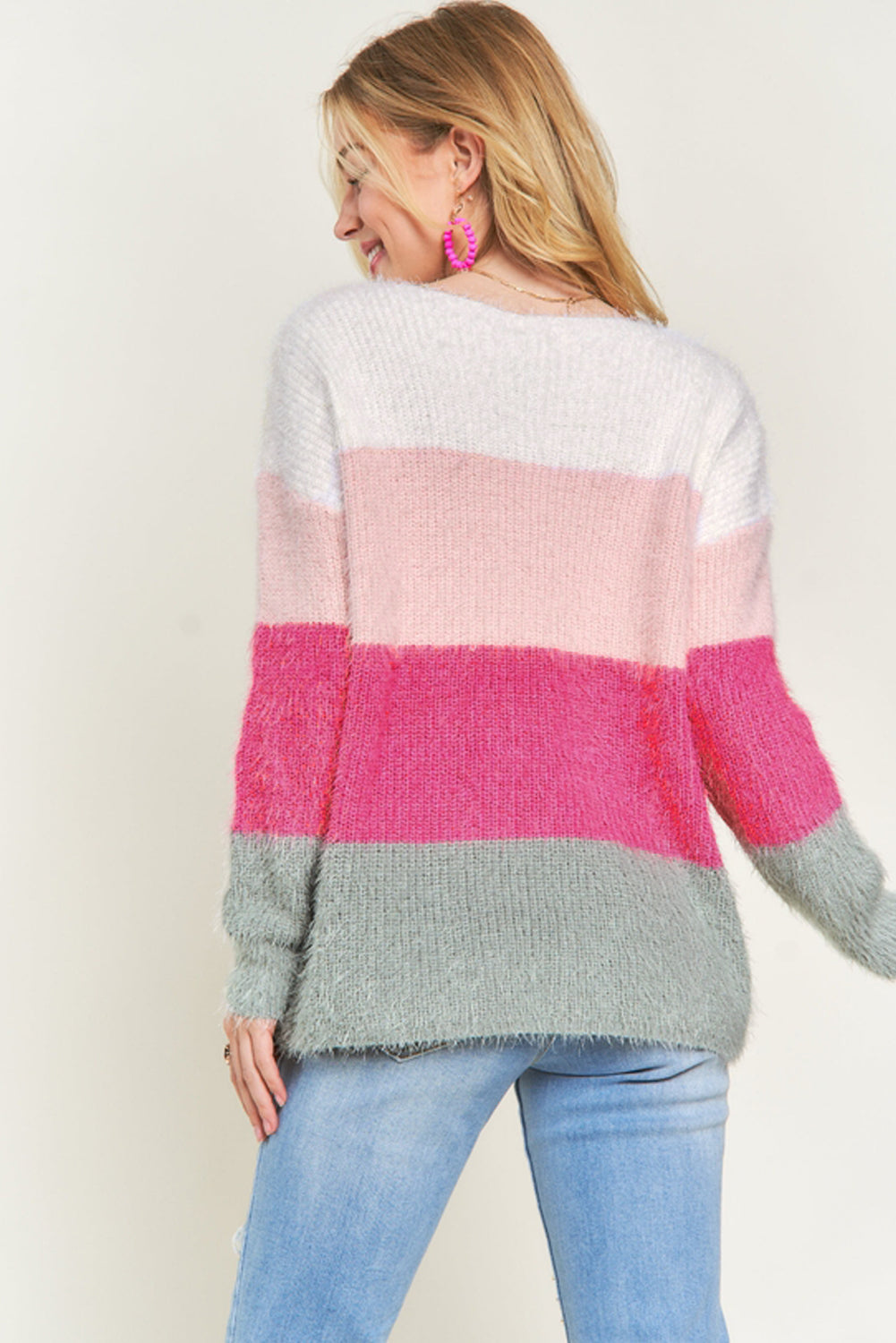 A cozy striped color block fuzzy V neck sweater in vibrant colors, perfect for chilly days and stylish outfits.