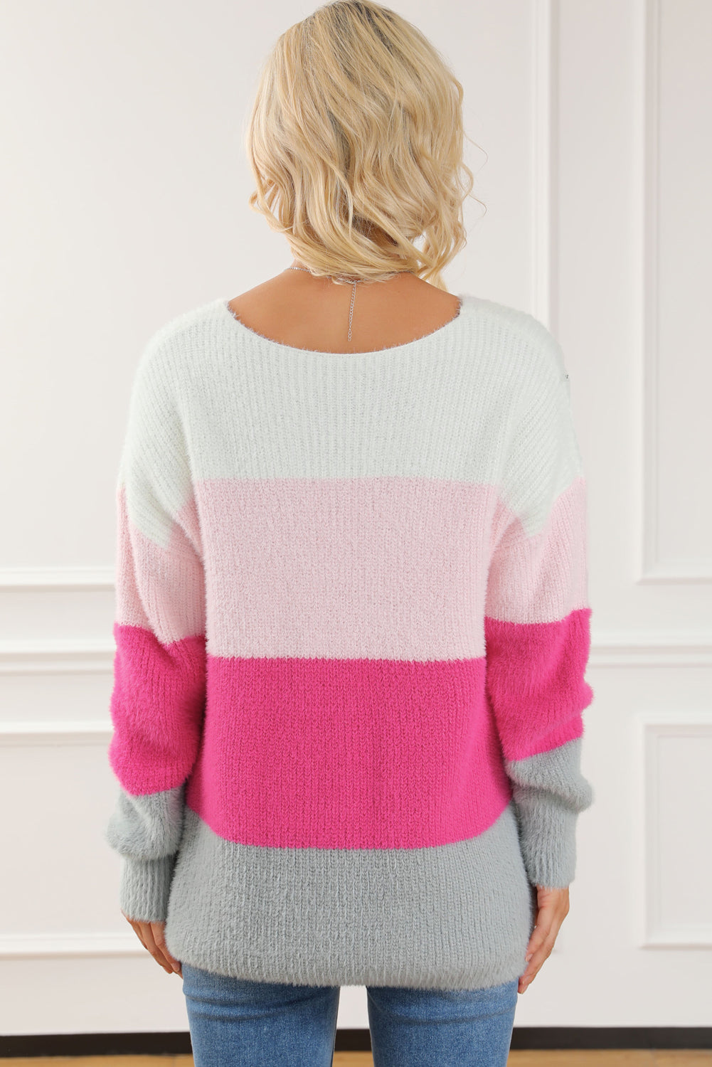 A cozy striped color block fuzzy V neck sweater in vibrant colors, perfect for chilly days and stylish outfits.