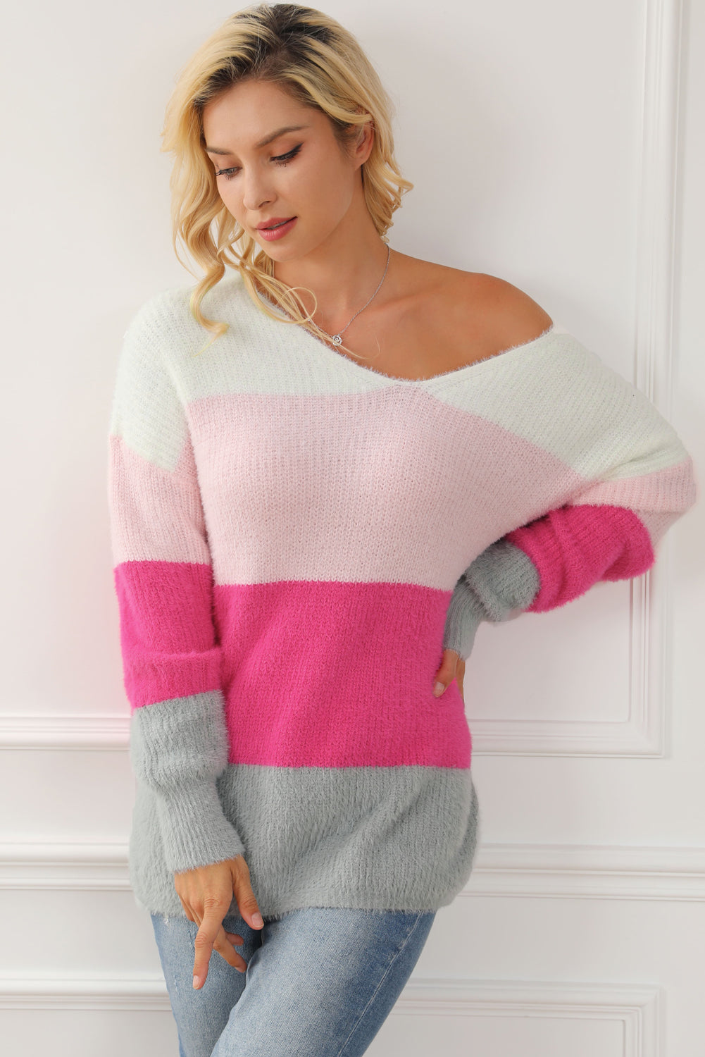 A cozy striped color block fuzzy V neck sweater in vibrant colors, perfect for chilly days and stylish outfits.