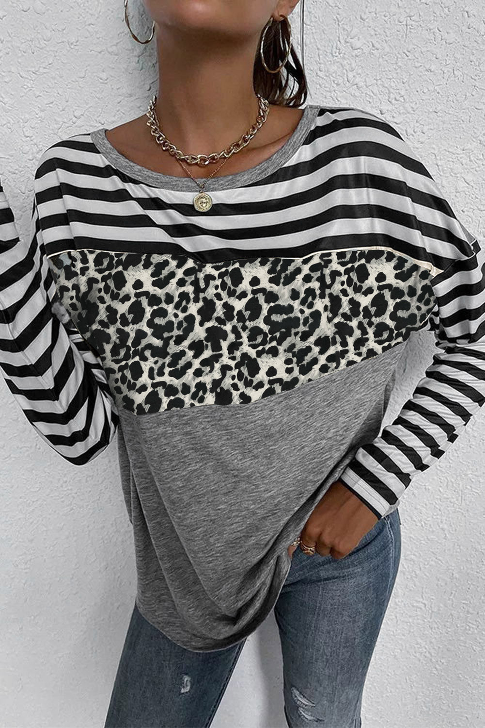 A stylish Striped Leopard Block Splicing Long Sleeve Top featuring a mix of leopard print, stripes, and solid colors, perfect for modern women.