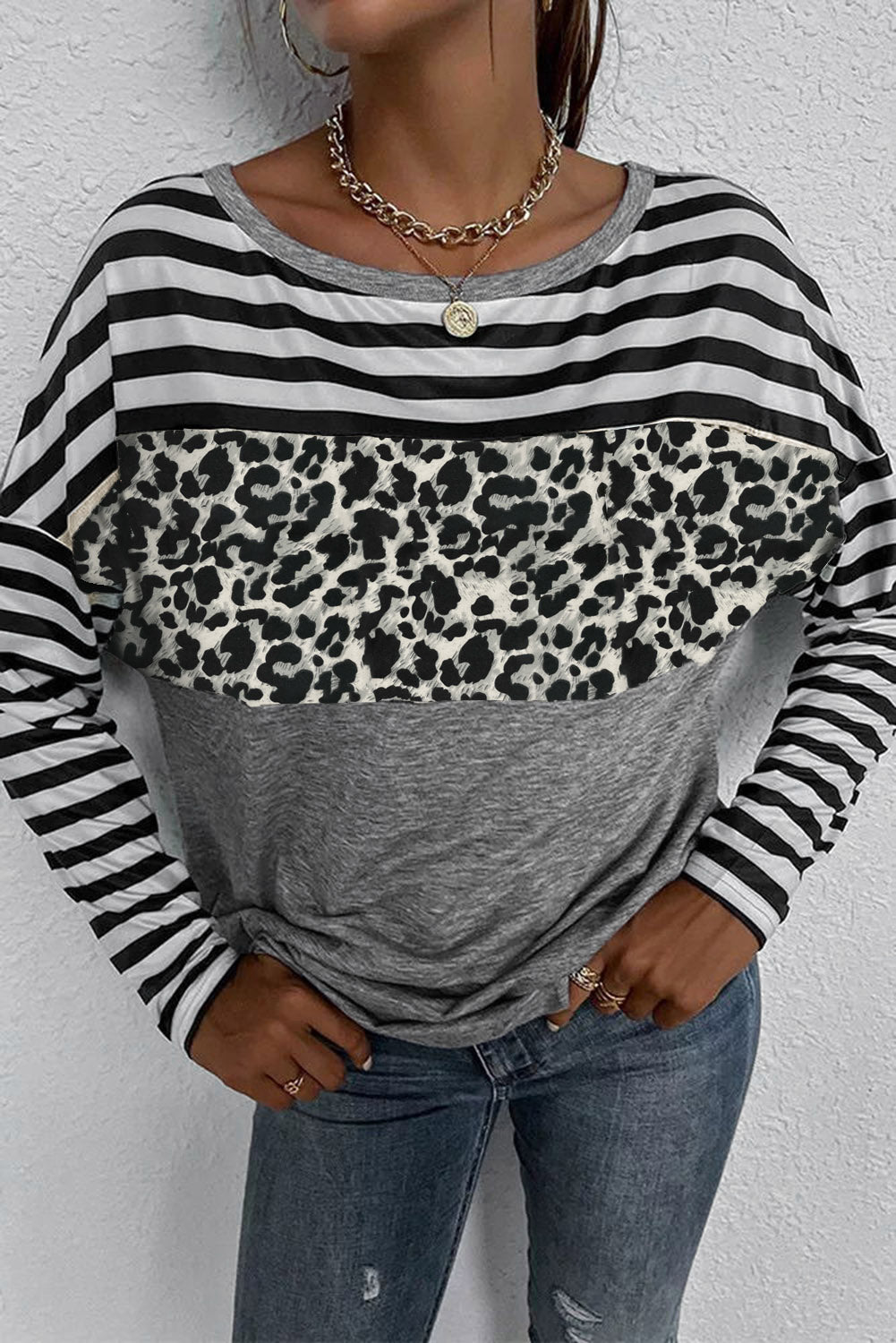 A stylish Striped Leopard Block Splicing Long Sleeve Top featuring a mix of leopard print, stripes, and solid colors, perfect for modern women.