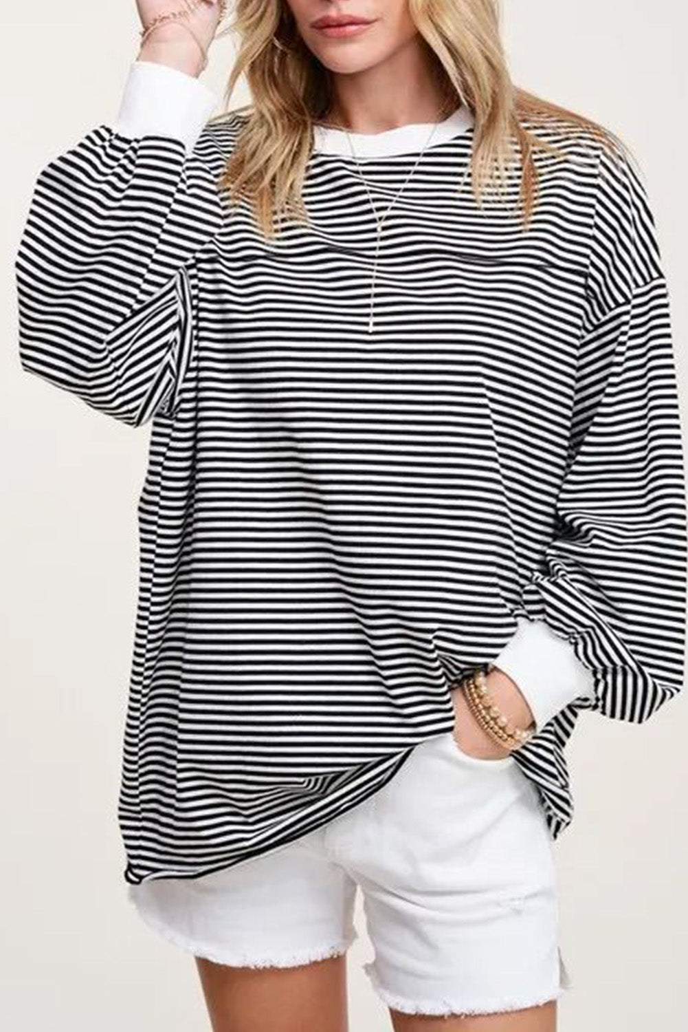 A stylish striped print drop shoulder loose sweatshirt, perfect for casual wear in cooler seasons, featuring long sleeves and a relaxed fit.