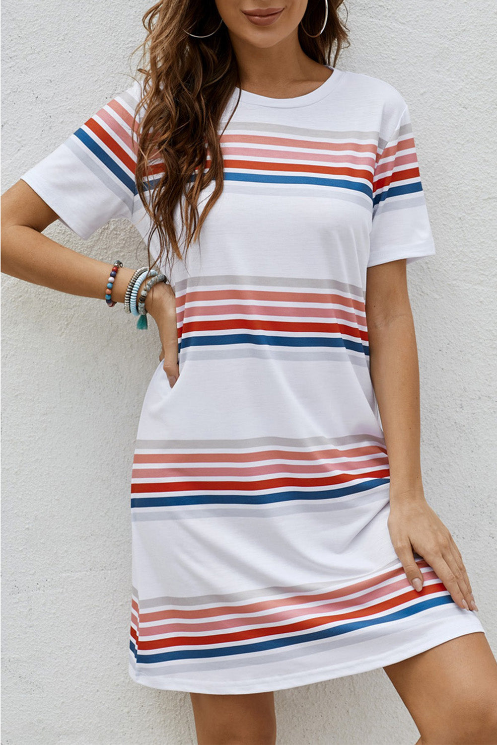 A stylish striped print round neck t-shirt mini dress displayed on a mannequin, showcasing its casual and chic design.