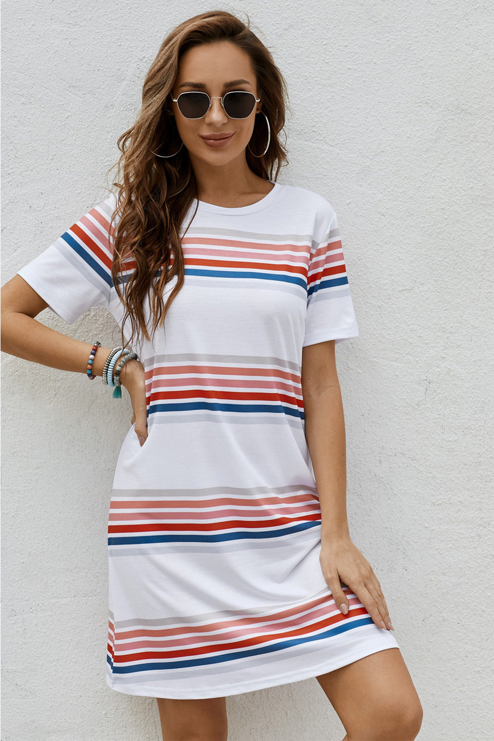 A stylish striped print round neck t-shirt mini dress displayed on a mannequin, showcasing its casual and chic design.