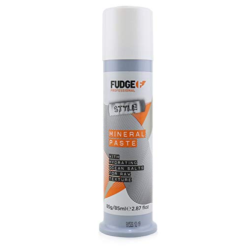 Fudge Styling Mineral Paste in a sleek container, showcasing its creamy texture and branding.