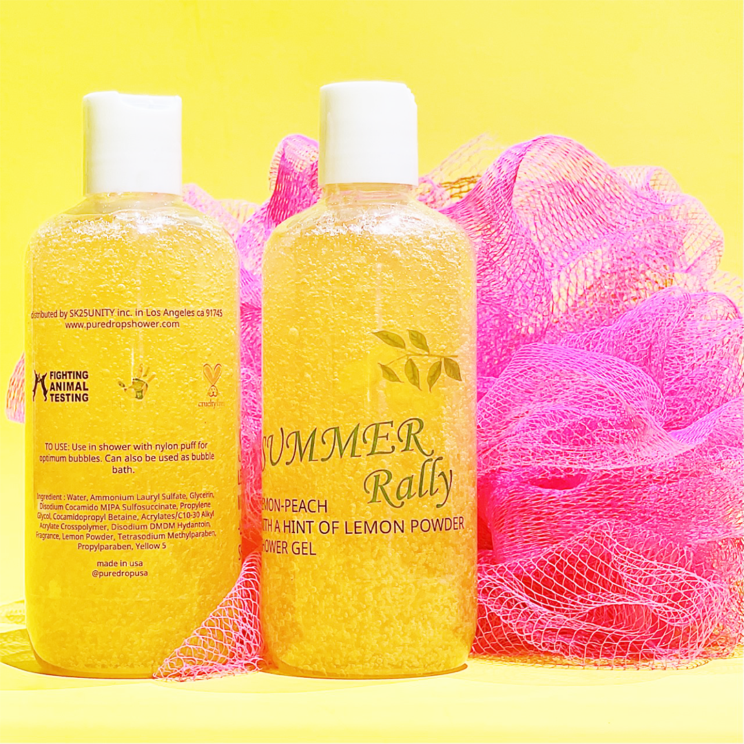 A bottle of Summer Rally Lemon Body Wash with a vibrant lemon design, showcasing its refreshing lemon-peach scent and creamy lather.