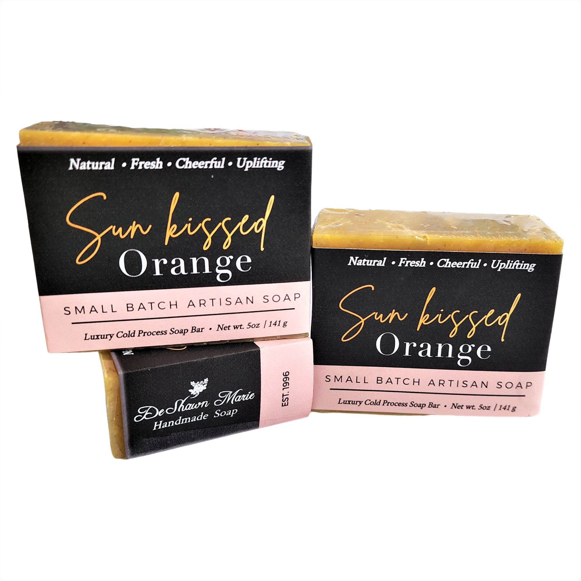 A vibrant Sun Kissed Orange Soap bar with a bright orange color, showcasing its handcrafted texture and packaging, evoking the essence of fresh Florida oranges.