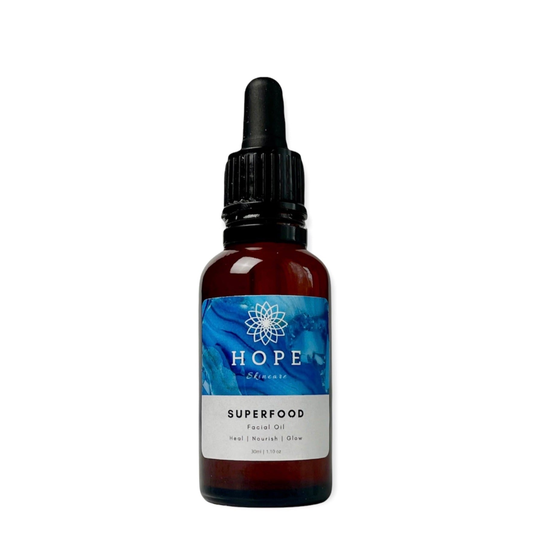 A bottle of SUPERFOOD Facial Oil featuring a blend of 11 nourishing oils for skin hydration and restoration.