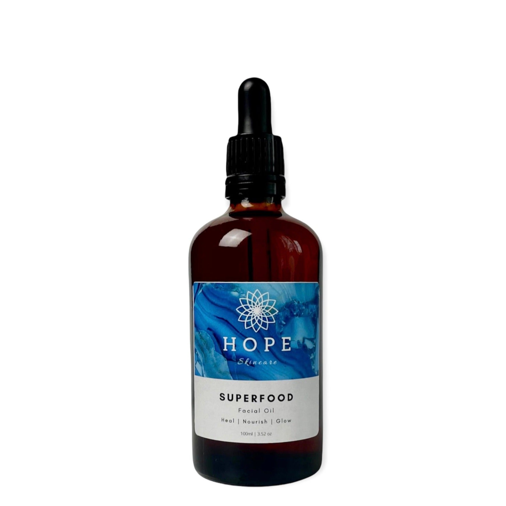 A bottle of SUPERFOOD Facial Oil featuring a blend of 11 nourishing oils for skin hydration and restoration.