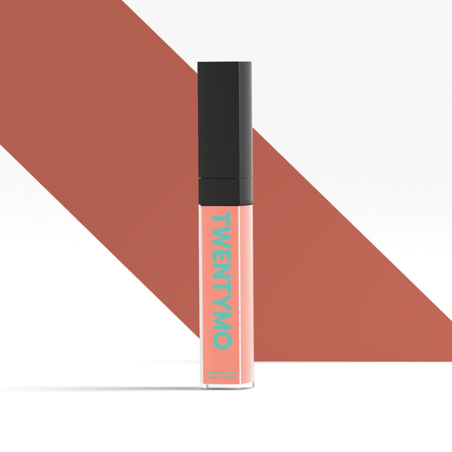 Tangerine Queen high-coverage liquid lipstick in a sleek tube, showcasing its vibrant orange color and creamy texture.