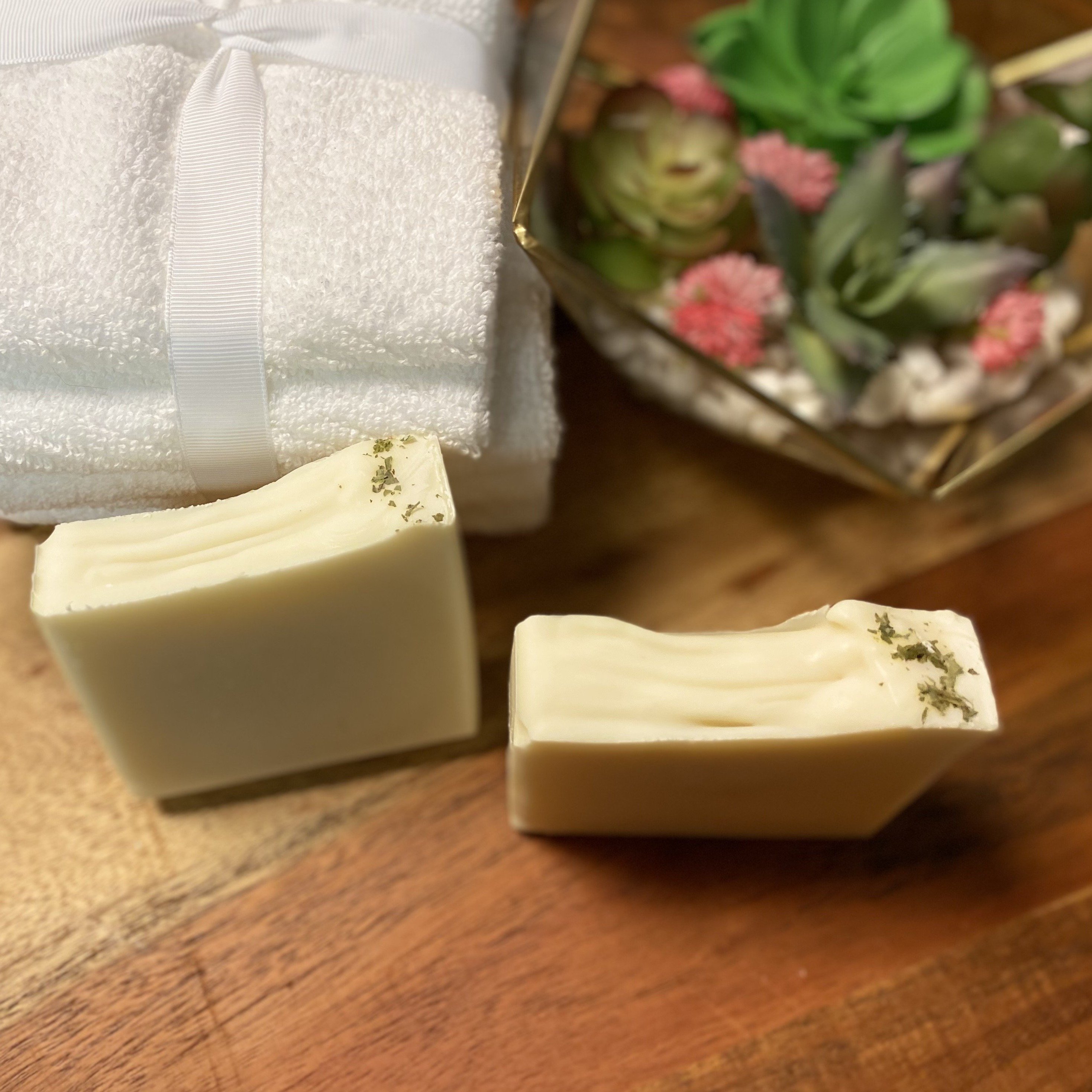 Tee Tree Shampoo Bar Soap with mint leaves, showcasing its creamy texture and natural ingredients.