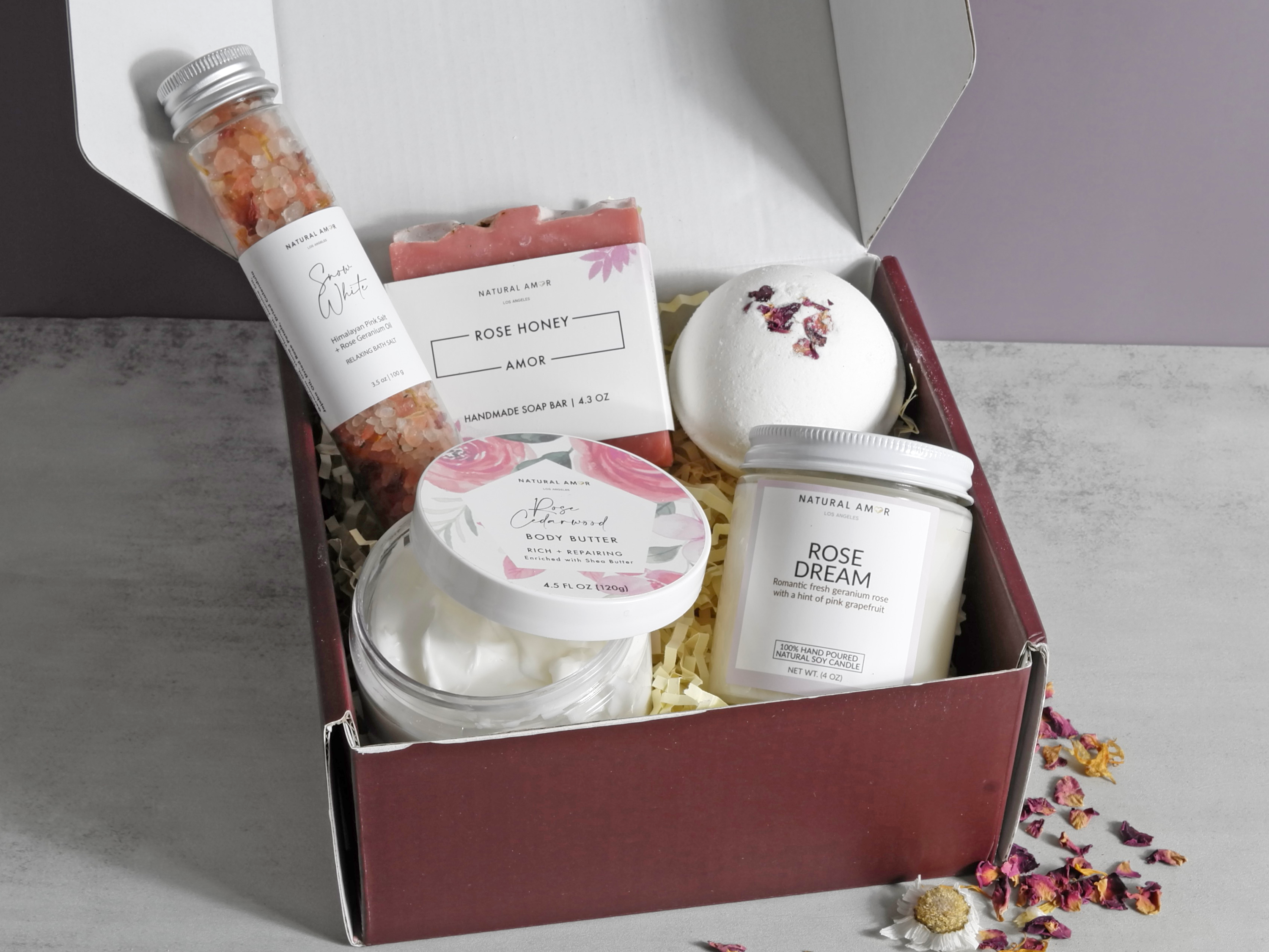 Thinking of You gift box featuring natural skincare products including soap, bath salts, body yogurt, bath bomb, and a soy candle.