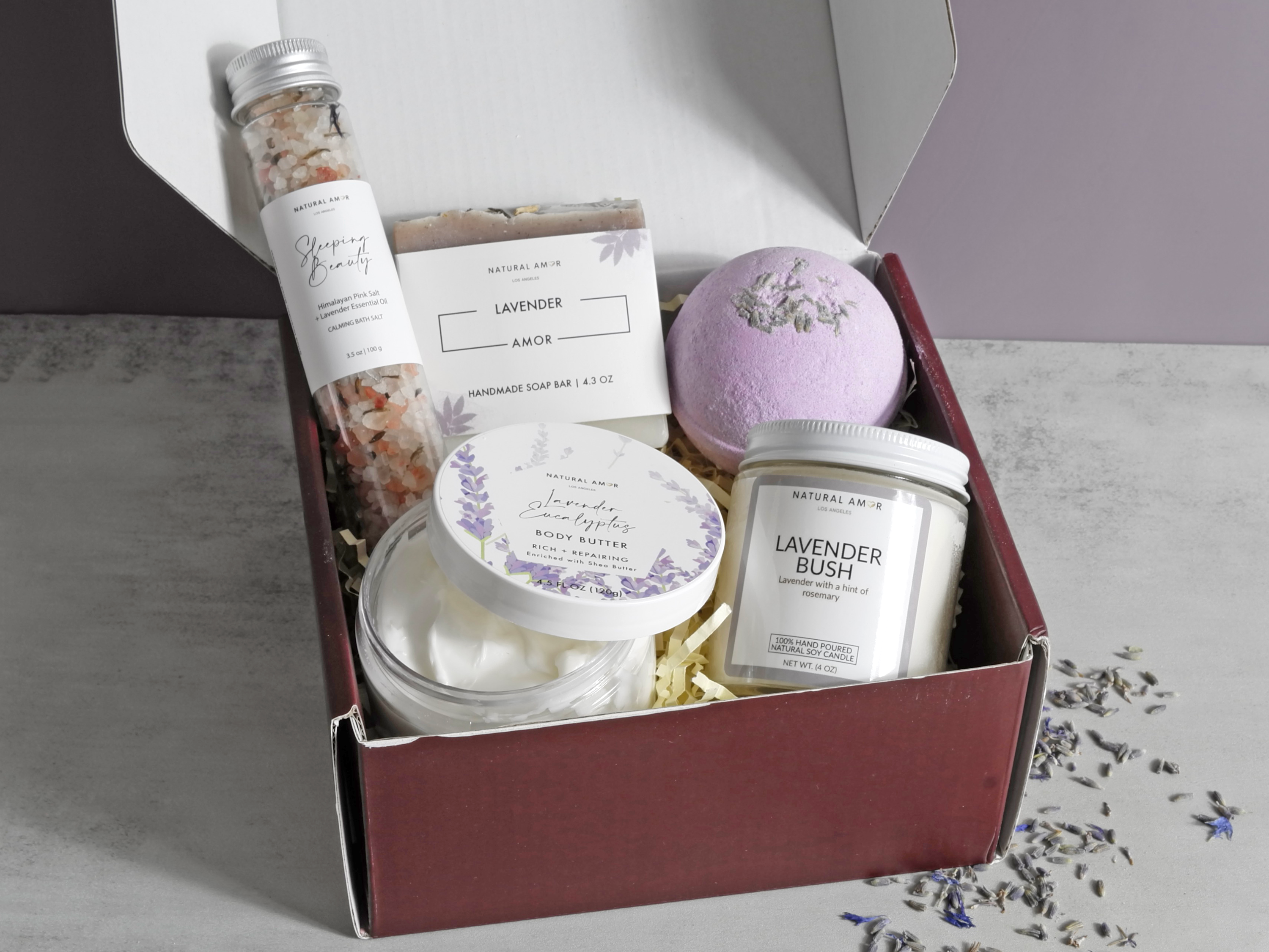 Thinking of You gift box featuring natural skincare products including soap, bath salts, body yogurt, bath bomb, and a soy candle.