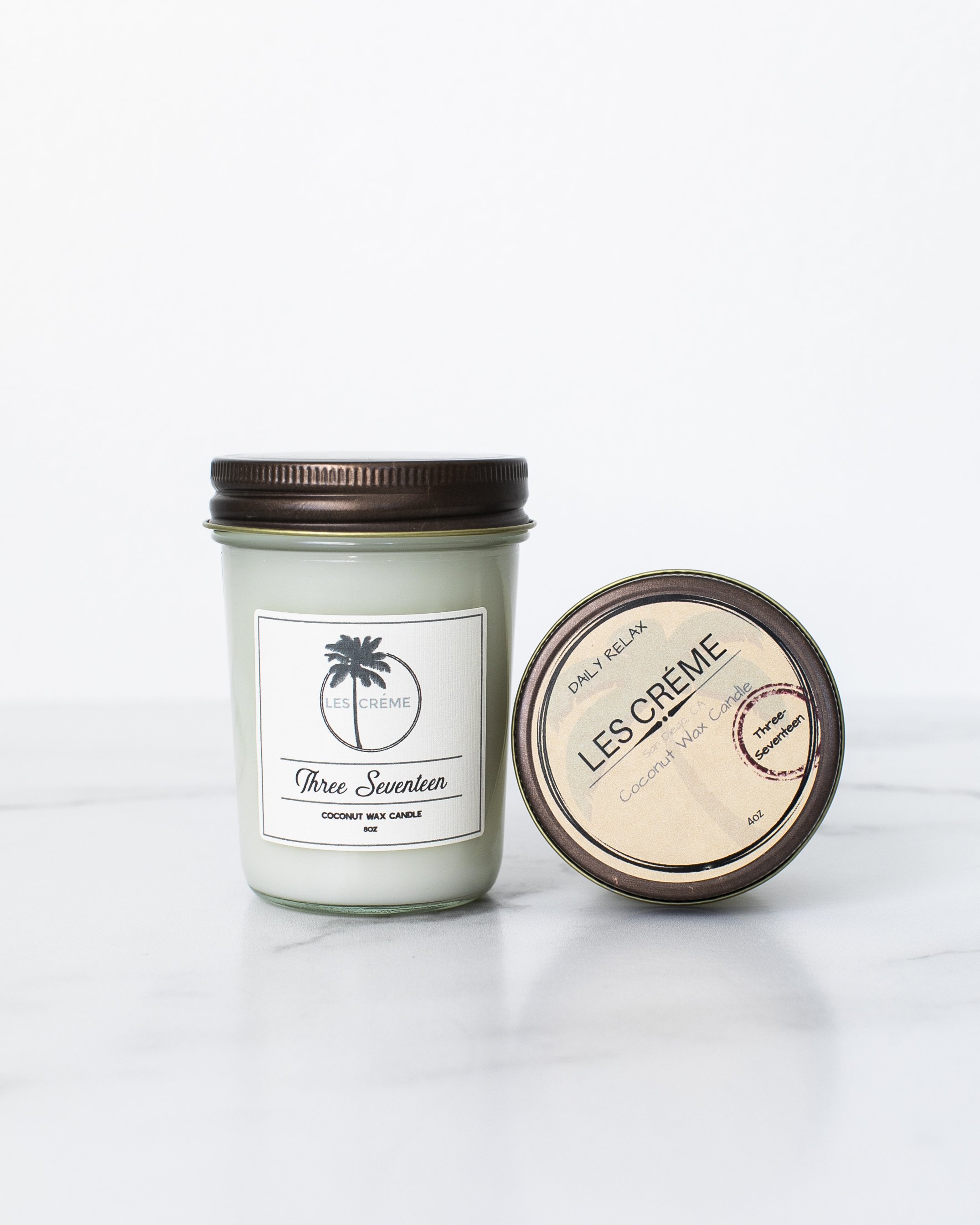 Three Seventeen Coconut Wax Candle in a stylish jar, showcasing its earthy and musky scent, perfect for home decor.