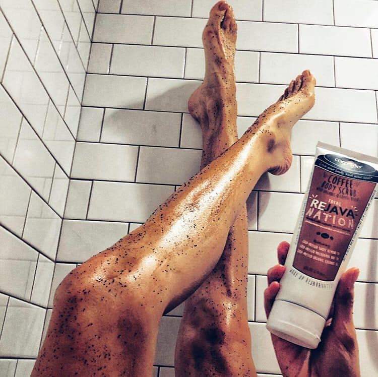 Total ReJAVAnation Coffee Scrub in an 8 oz squeeze tube, showcasing its natural ingredients and rich coffee color.