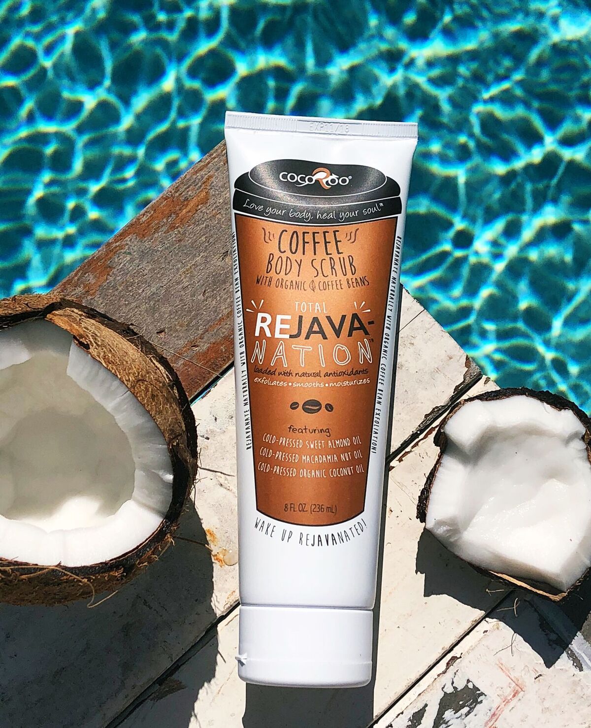 Total ReJAVAnation Coffee Scrub in an 8 oz squeeze tube, showcasing its natural ingredients and rich coffee color.