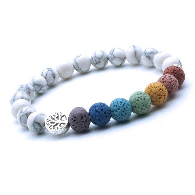 Tree of Life 7 Chakra Lava Stones Bracelet featuring colorful lava stones and a white stone, ideal for essential oil diffusion.