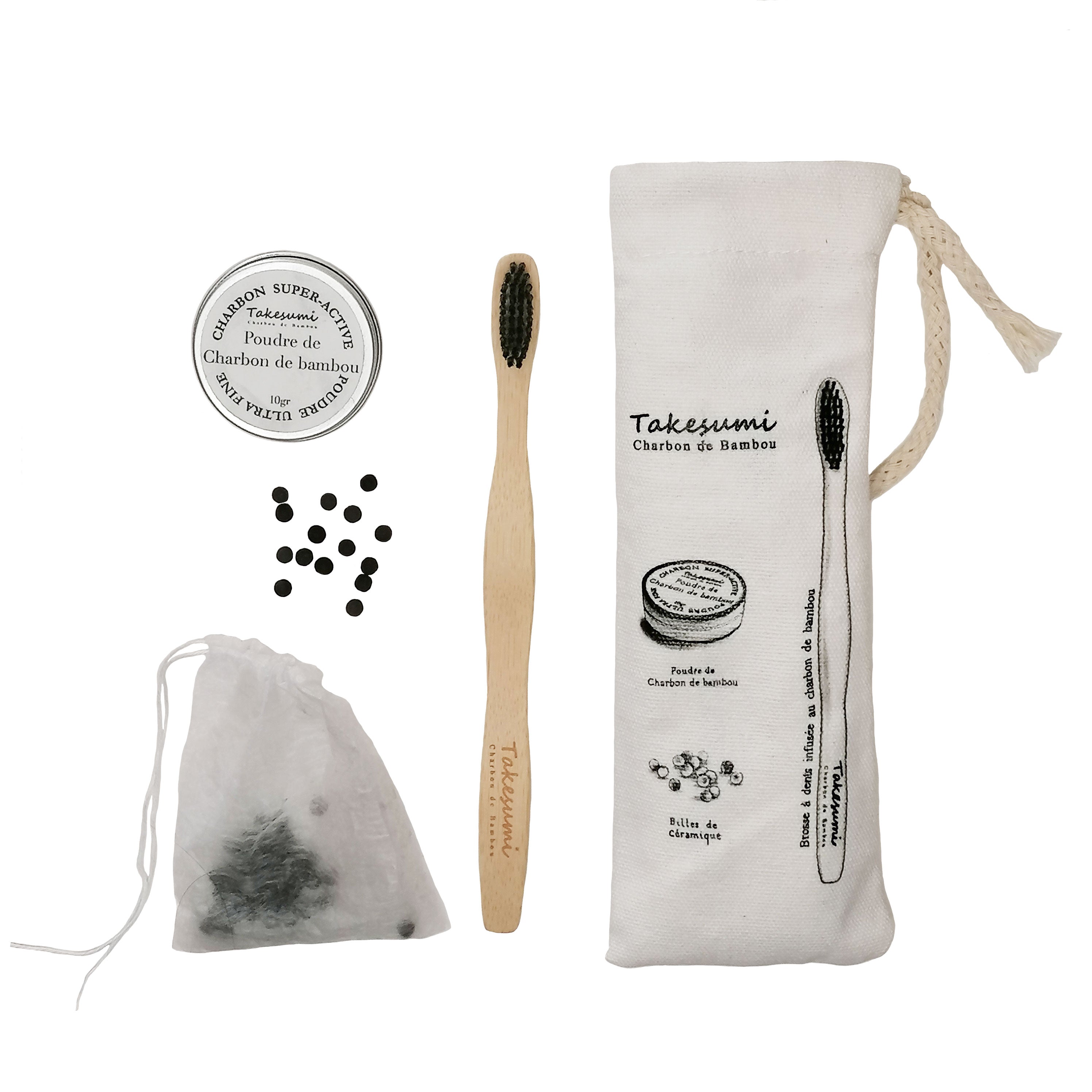 Trio hygiène bucco-dentaire au charbon de bambou comprenant une brosse à dents, de la poudre de charbon et des billes céramiques, présenté dans un pochon en coton naturel.