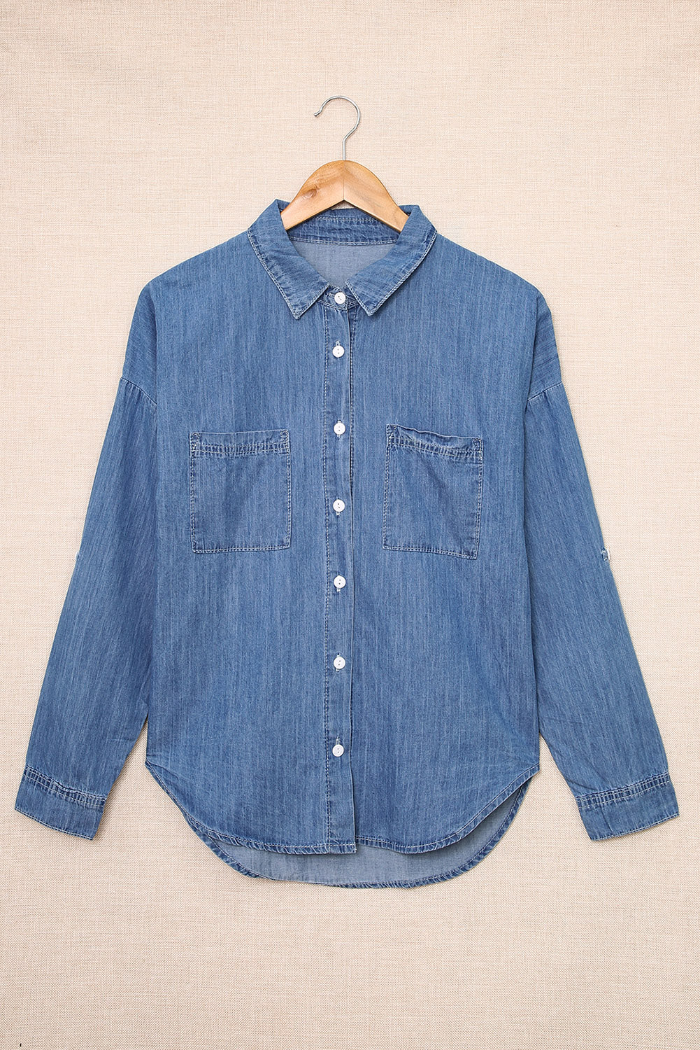 A stylish Turn Down Collar Buttoned Long Sleeve Denim Shirt featuring a classic boyfriend style, button closure, and front pocket.