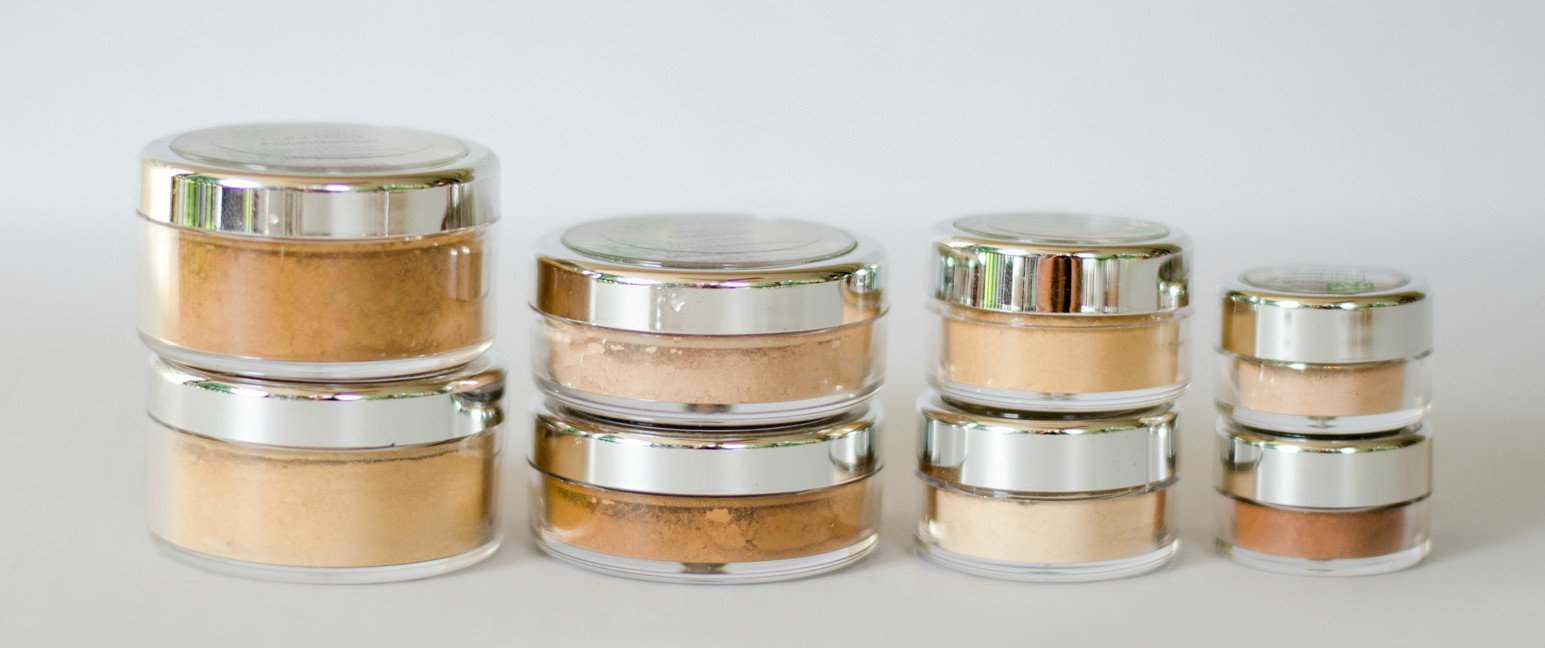 Vegan cruelty-free face powder in various shades displayed in jars, showcasing its natural mineral ingredients.